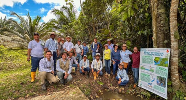 Group photo of technical team and local community