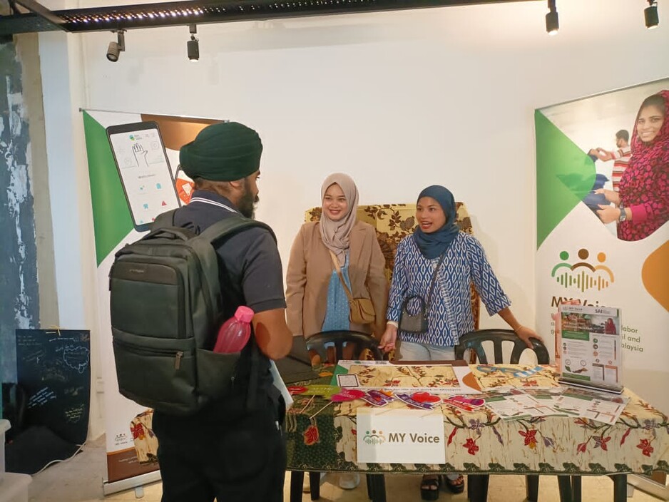 A visitor at MY Voice’s booth